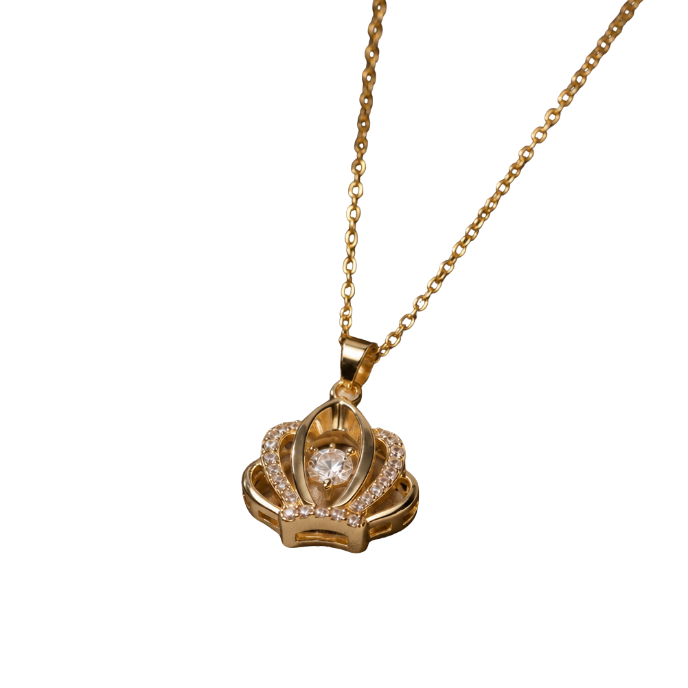 A gold pendant necklace featuring a crown-like design with a central clear gemstone and small pavé-set stones, suspended from a delicate gold chain against a plain white background.