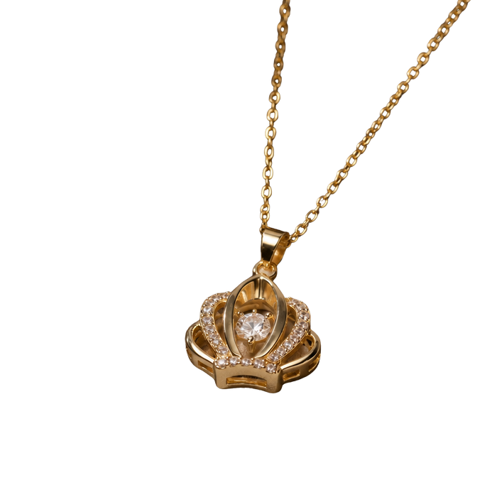 A gold pendant necklace featuring a crown-like design with a central clear gemstone and small pavé-set stones, suspended from a delicate gold chain against a plain white background.