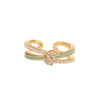 A gold-toned open band ring featuring a central floral cluster of small clear stones and a light green enamel accent stripe, shown on a plain white background.