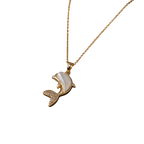 A gold-tone necklace with a dolphin pendant featuring a white mother-of-pearl shell inlay and small clear rhinestone accents on the tail, shown against a plain white background.