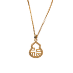 A gold chain necklace with a small, gold pendant featuring a stylized Chinese character for 'fortune' surrounded by tiny clear stones, shown against a plain white background.