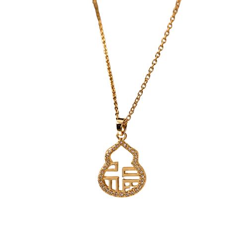 A gold chain necklace with a small, gold pendant featuring a stylized Chinese character for 'fortune' surrounded by tiny clear stones, shown against a plain white background.