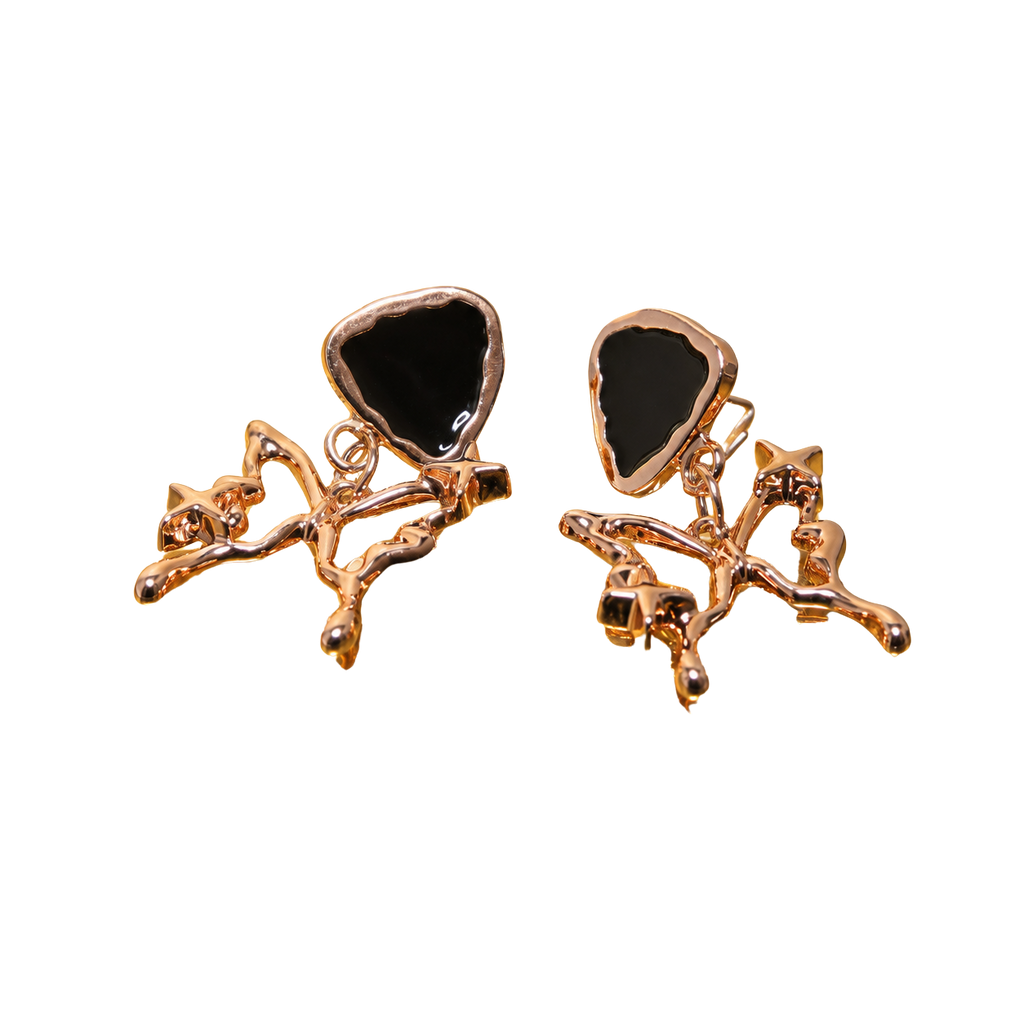 A pair of rose gold earrings featuring a polished triangular black stone inlay, set within an organic, branch-like rose gold metal design, shown against a plain white background.